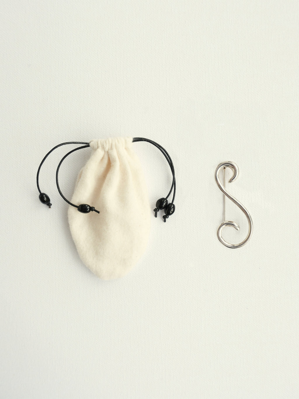 Robin sterling silver brooch with handmade flannel pouch, CARMA silver objects